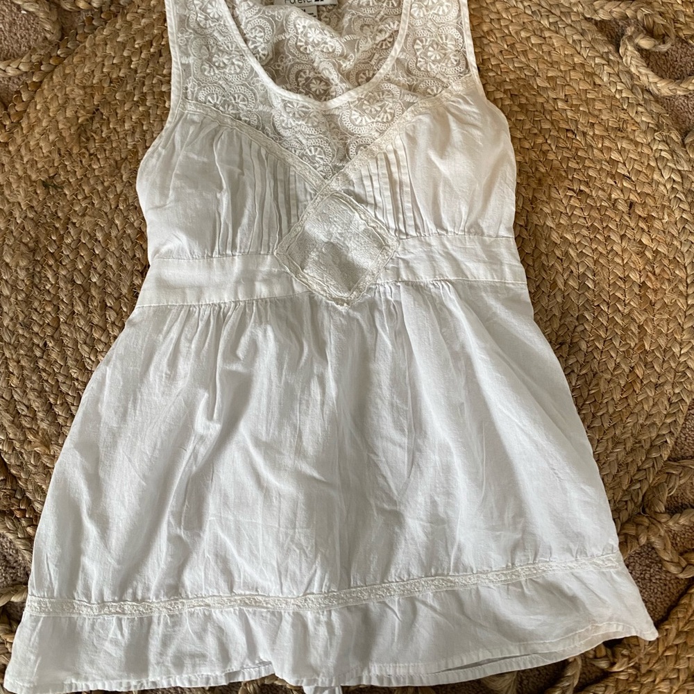 Sleeveless white shirt